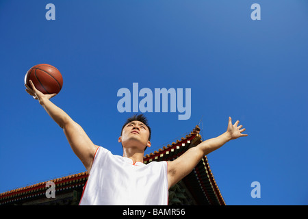 Portrait Of Young Basketball Player In Front Of Temple