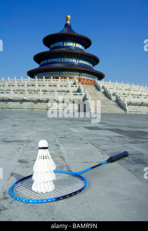 Badminton Racquet And Shuttlecocks In Front Of Temple Stock Photo