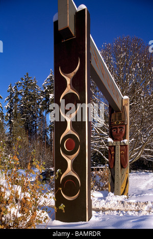 Carved Coast Salish Totem Gateway in Winter at Brockton Point in Stanley Park Vancouver British Columbia Canada Stock Photo