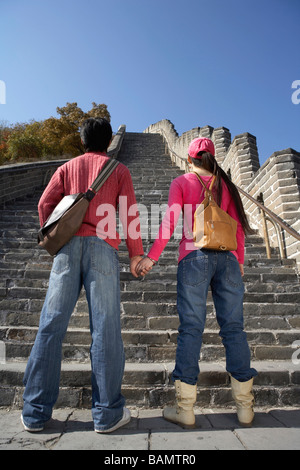 Young Couple Visiting The Great Wall Of China Stock Photo