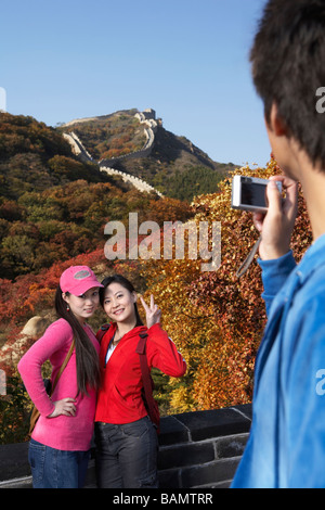 Young Women Getting Their Picture Taken On The Great Wall Of China Stock Photo