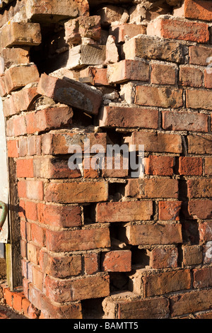 dilapidated brick wall of old building Stock Photo