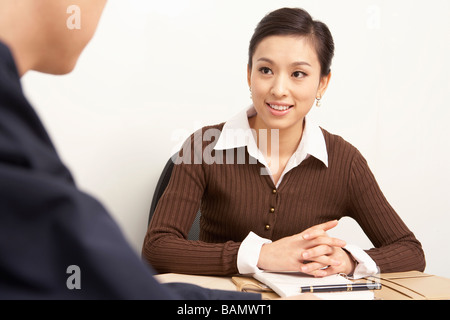 Businesspeople Having A Discussion In A Board Room Stock Photo