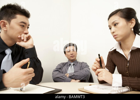 Businesspeople Having A Discussion In A Board Room Stock Photo