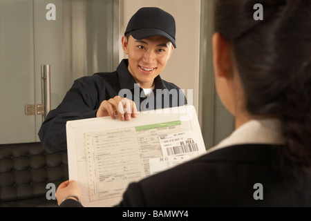 Courier Delivering Package Stock Photo