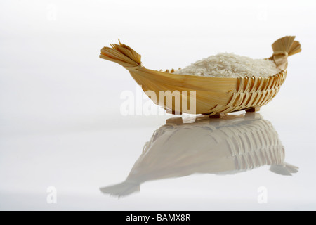 Rice in a woven basket Stock Photo