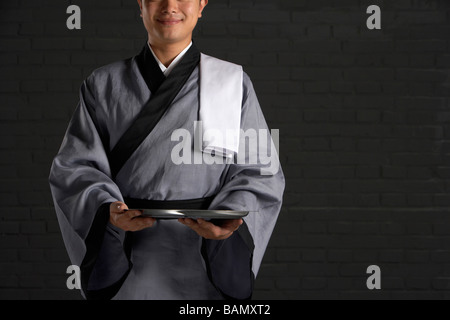 Tradtional Chinese waiter Stock Photo