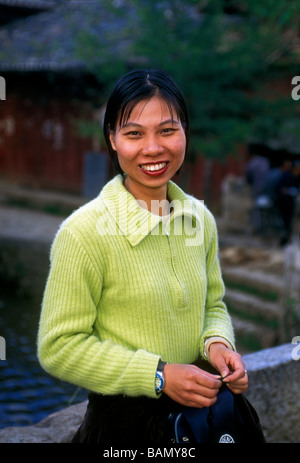1, one, Chinese woman, young adult woman, adult woman, friendly, eye contact, front view, Old Town, Lijiang, Yunnan Province, China, Asia Stock Photo