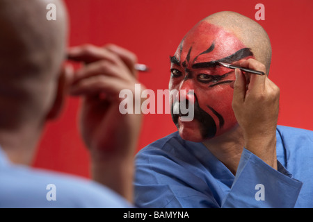 An Actor Portrays Guang Gong, Ancient Chinese General in Beijing Opera Costume, Represents Protection and Wealth Stock Photo