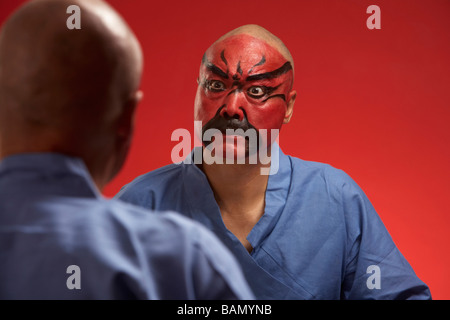 An Actor Portrays Guang Gong, Ancient Chinese General in Beijing Opera Costume, Represents Protection and Wealth Stock Photo