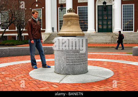 Male student looking at a replica of the Centennial Bell, Baker Library, Harvard Business School, Cambridge, Massachusetts, USA Stock Photo