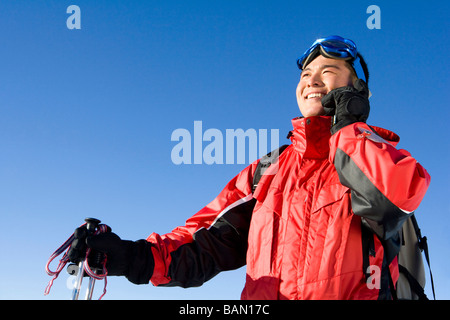 Young man in ski gear talking on his mobile phone Stock Photo