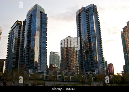 High rise apartment towers along Vancouver waterfront in reflect upon each other in the warm glow of the setting sun Stock Photo