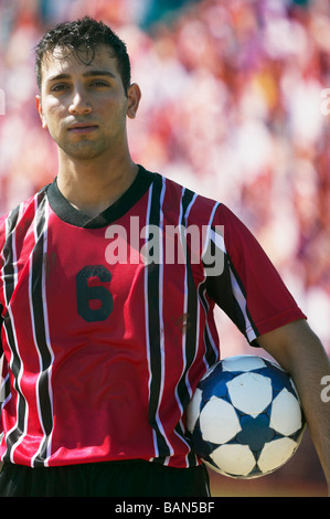 Soccer player posing for the camera Stock Photo