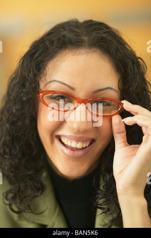 Young businesswoman wearing red glasses Stock Photo