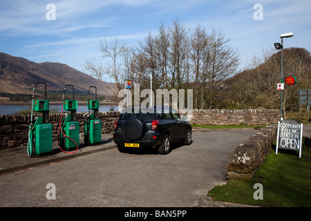 A 2009 village petrol station taken over by a community group. Tourist Car at Filling Station  Applecross, Loch Carron, Wester Ross, Scotland Stock Photo