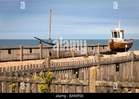 Two traditional, clinker built fishing boats on the shingle at Deal Stock Photo