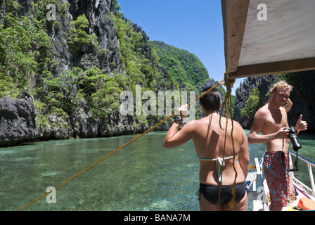 Tourists on an island hopping trip through the Bacuit Archipelago, Palawan, Philippines Stock Photo