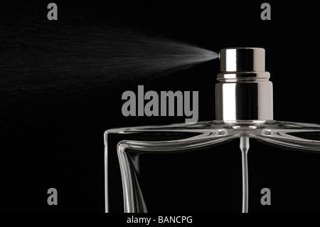 Perfume Spray Against a Black Background Stock Photo