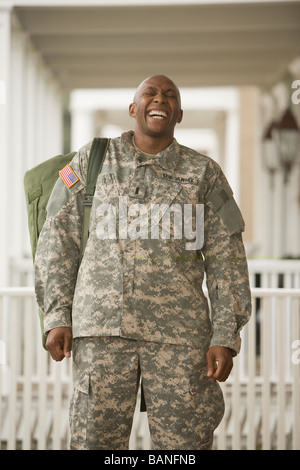 African man in military uniform laughing Stock Photo
