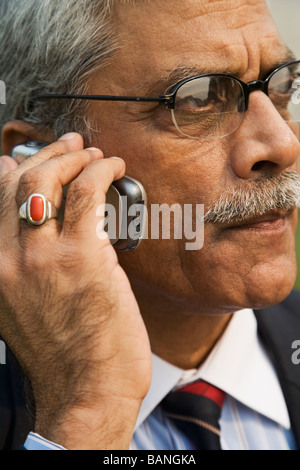Indian businessman talking on cell phone Stock Photo