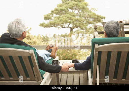 Senior couple holding hands outdoors Stock Photo