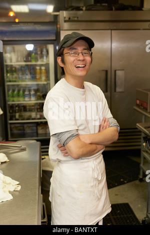 Japanese chef smiling with arms crossed Stock Photo
