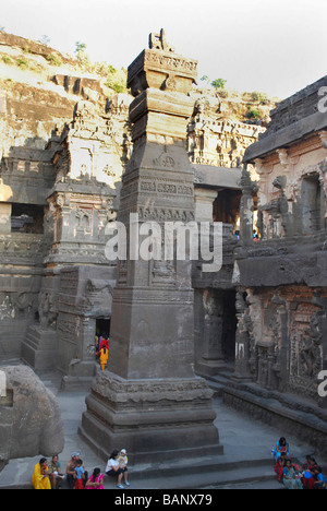 Cave No 16 : Temple courtyard and victory pillar.  Dhvaja stamba. Ellora, Aurangabad, Maharashtra, India. Stock Photo