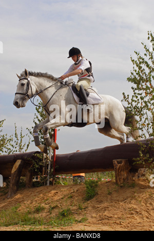 Horse rider jumps a fence during a three day eventing competition at Moscow, Russia Stock Photo