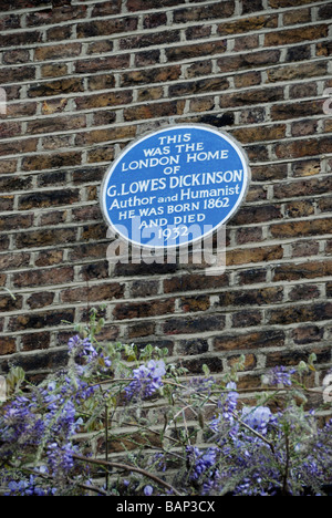 Blue plaque marking the former home of author and humanist Goldsworthy Lowes Dickinson in Edwardes Sq Kensington London Stock Photo