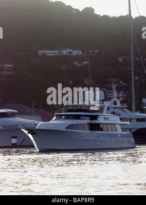 Super yacht manoeuvring in Gustavia harbor on St Barts Stock Photo