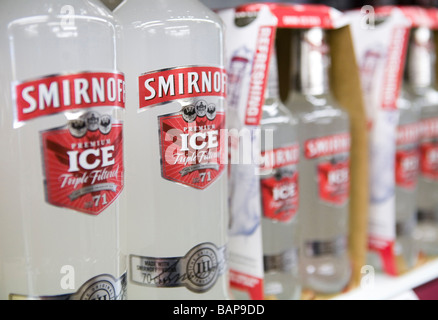 Bottles of Smirnoff Ice on the shelf in an off license Stock Photo