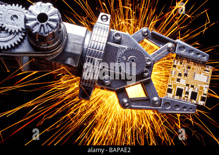 Robot arm with mini circuit board Stock Photo