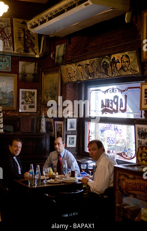 A group of executives having dinner in La Perla Bar in Caminito, La Boca, Buenos Aires, Argentina. Stock Photo