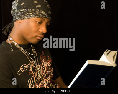 Young man reading a book. Stock Photo