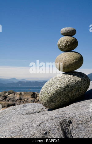 Rocks stacked on beach, English Bay, Vancouver BC Stock Photo