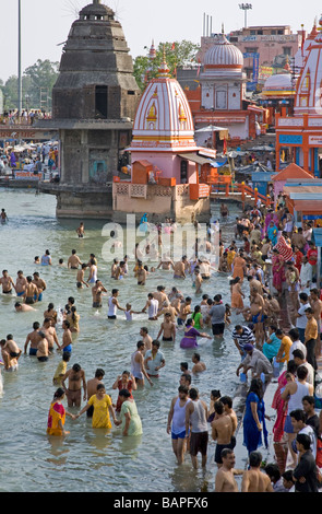 Pilgrims bathing at Har Ki Pairi ghat by the Ganges river 