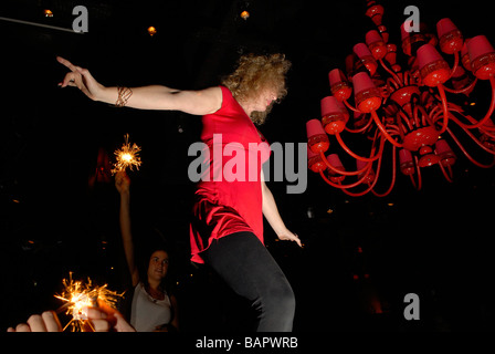 Young woman dancing in a dancebar downtown Tel Aviv, Israel Stock Photo