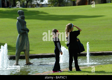 Two sisters beside Pioneer Women's Memorial fountains, Kings Park, Perth, Western Australia, Australia Stock Photo