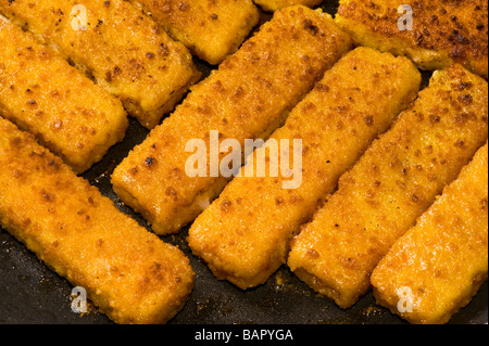 fried fish finger fish stick fry frying brown browning roast roasting roasted bake baking fat oil fryer fries seafood sea diet c Stock Photo