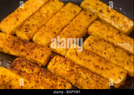 fried fish finger fish stick fry frying brown browning roast roasting roasted bake baking fat oil fryer fries seafood sea diet c Stock Photo