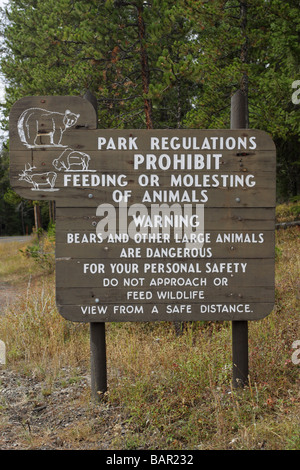 Sign for Fire Regulations for tourists by the side of the road in Yellowstone national Park Stock Photo