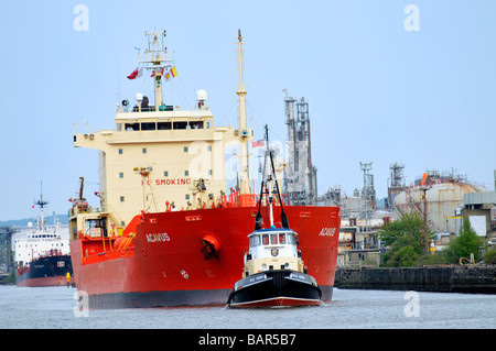 Tugboat MSC Viking guiding the bulk chemical oil products tanker Acavus Stock Photo