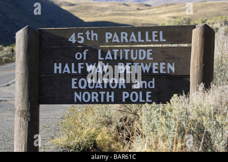 Sign 49th Parallel of Latitude halfway between the equator and North Pole in Yellowstone National Park Stock Photo