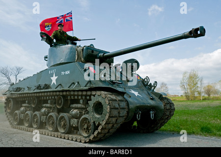 A fully restored IV Sherman tank flying the World War Two Canadian flag. Stock Photo