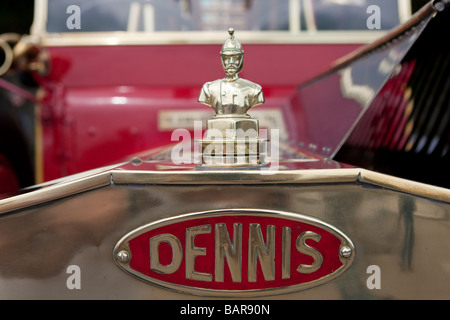 Brass radiator ornament in shape of fireman on 1914 Dennis N type pump / escape during vintage commercial vehicle rally Stock Photo