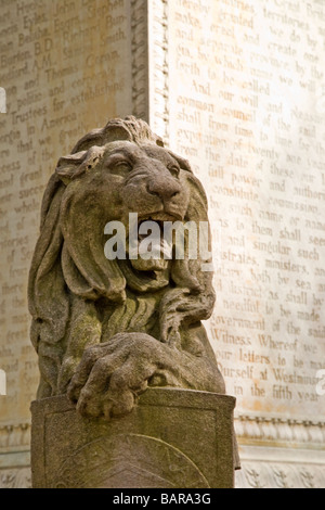 One of four lion sculptures at the base of the statue of James Oglethorpe in Chippewa Square in Savannah, Georgia Stock Photo