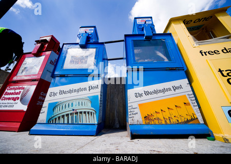 Newspaper vending machines on the sidewalk selling The Washington Post and the Washington Times in Washington DC USA. Stock Photo