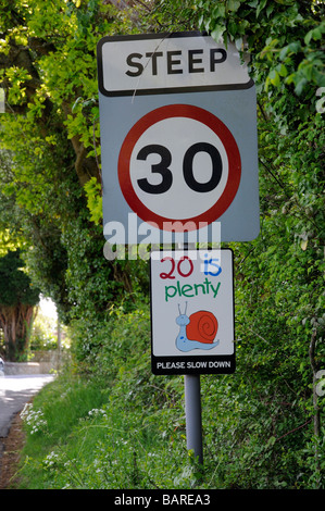 20 is plenty speed limit road signs 30 mph english village England UK Stock Photo