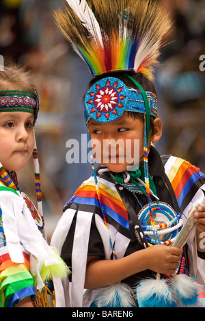 Two Young Male Dancers at the Gathering of Nations Powwow Share a Secret at Albuquerque, New Mexico Stock Photo